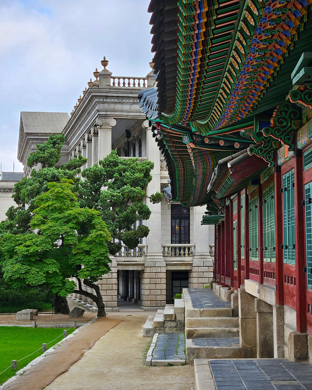 Scenic view of Deoksugung Palace's traditional and modern architectural blend in Seoul, South Korea.