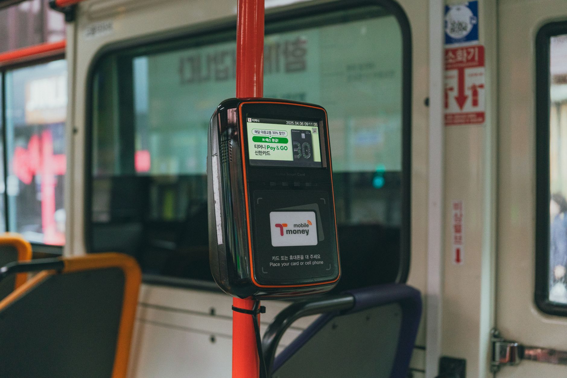 Card reader on a Seoul bus for convenient digital payments during city travel.
