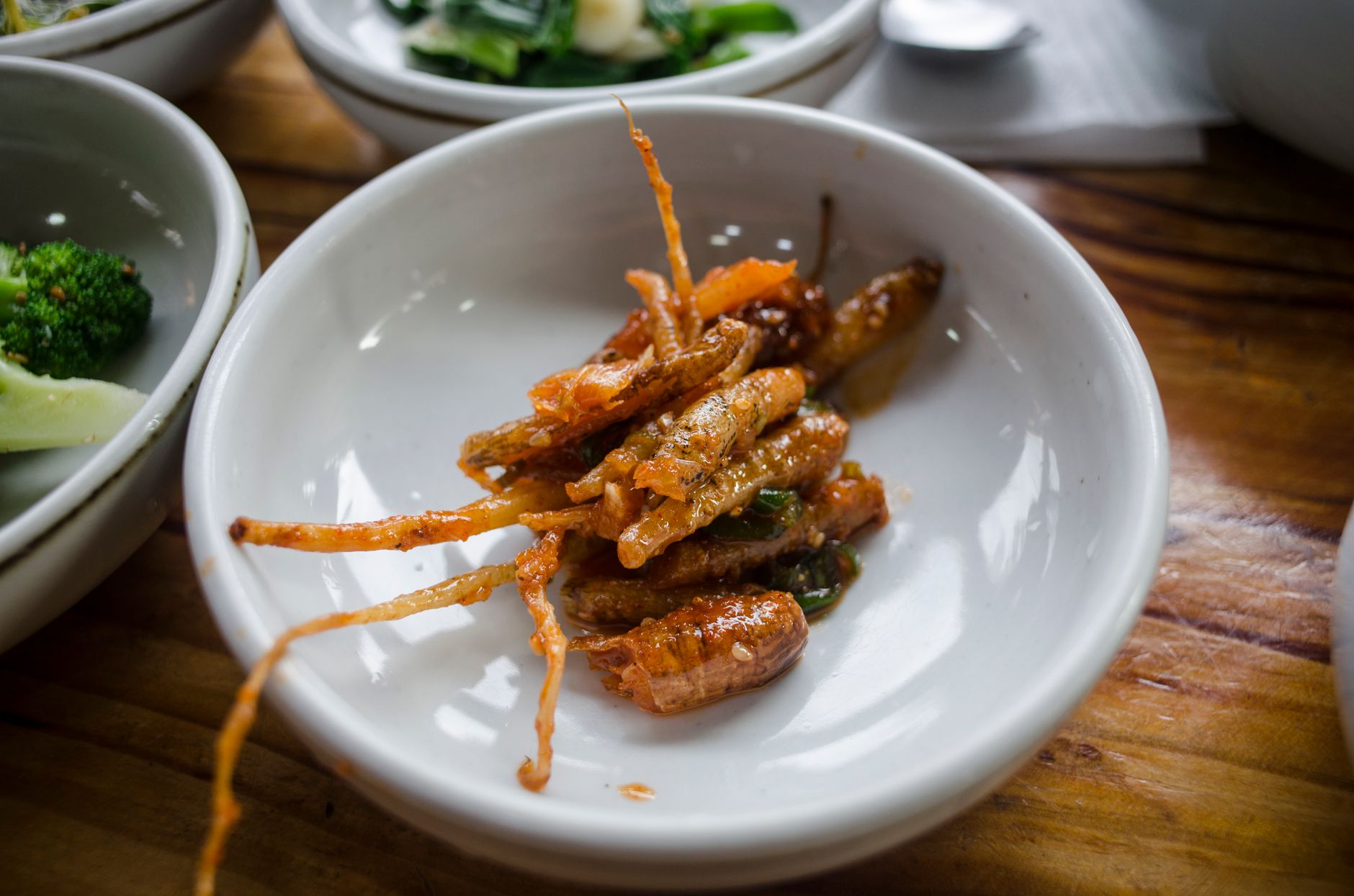 Close-up of a delicious Korean banchan side dish on a wooden table.