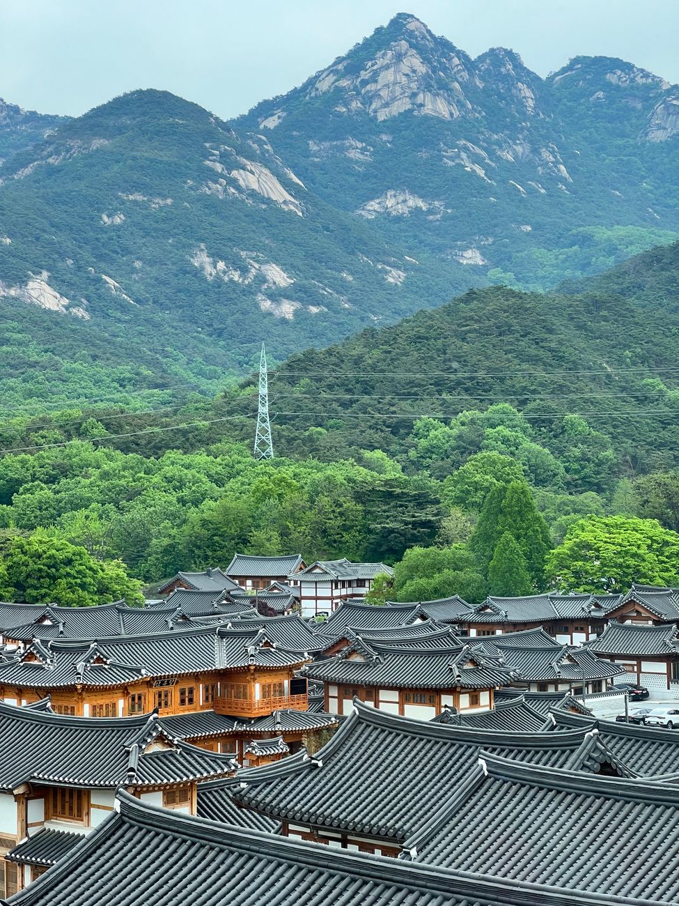 Discover the charm of Eunpyeong Hanok Village against the backdrop of Bukhansan Mountain in Seoul, South Korea.