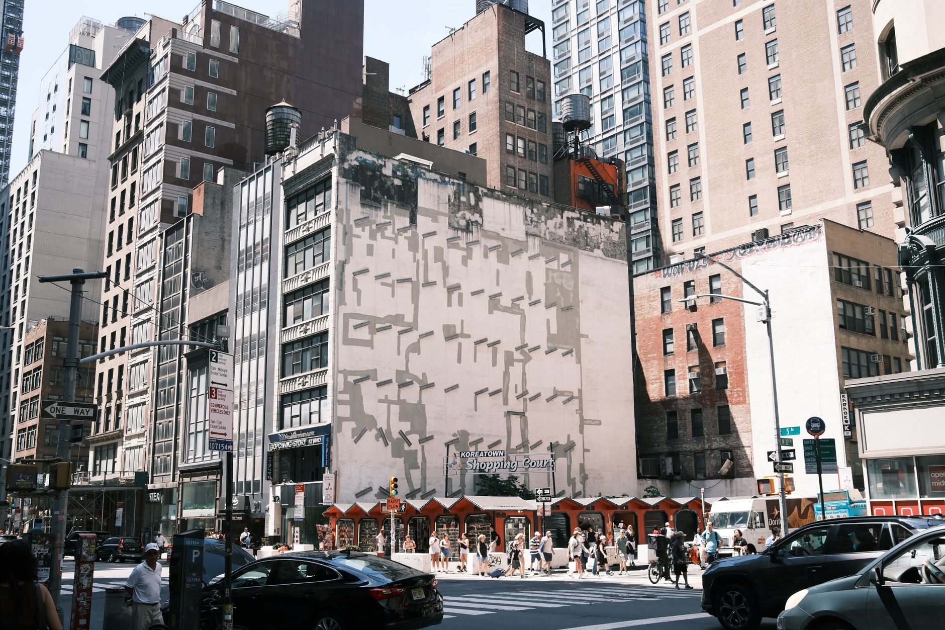 Vibrant city street with tall buildings in New York City, capturing daily urban life.