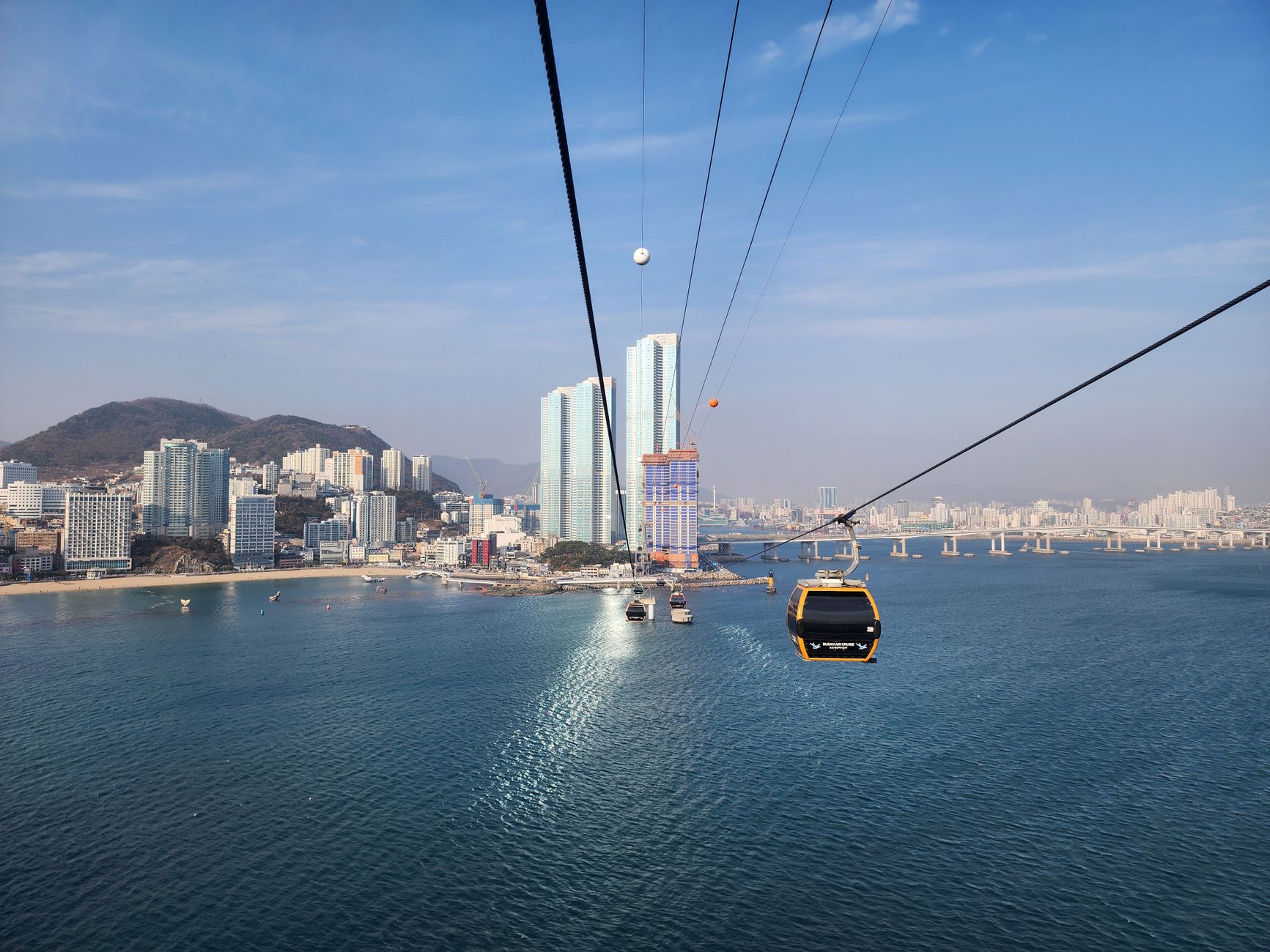 A breathtaking view of Busan cityscape and Songdo Bay from a cable car ride in South Korea.