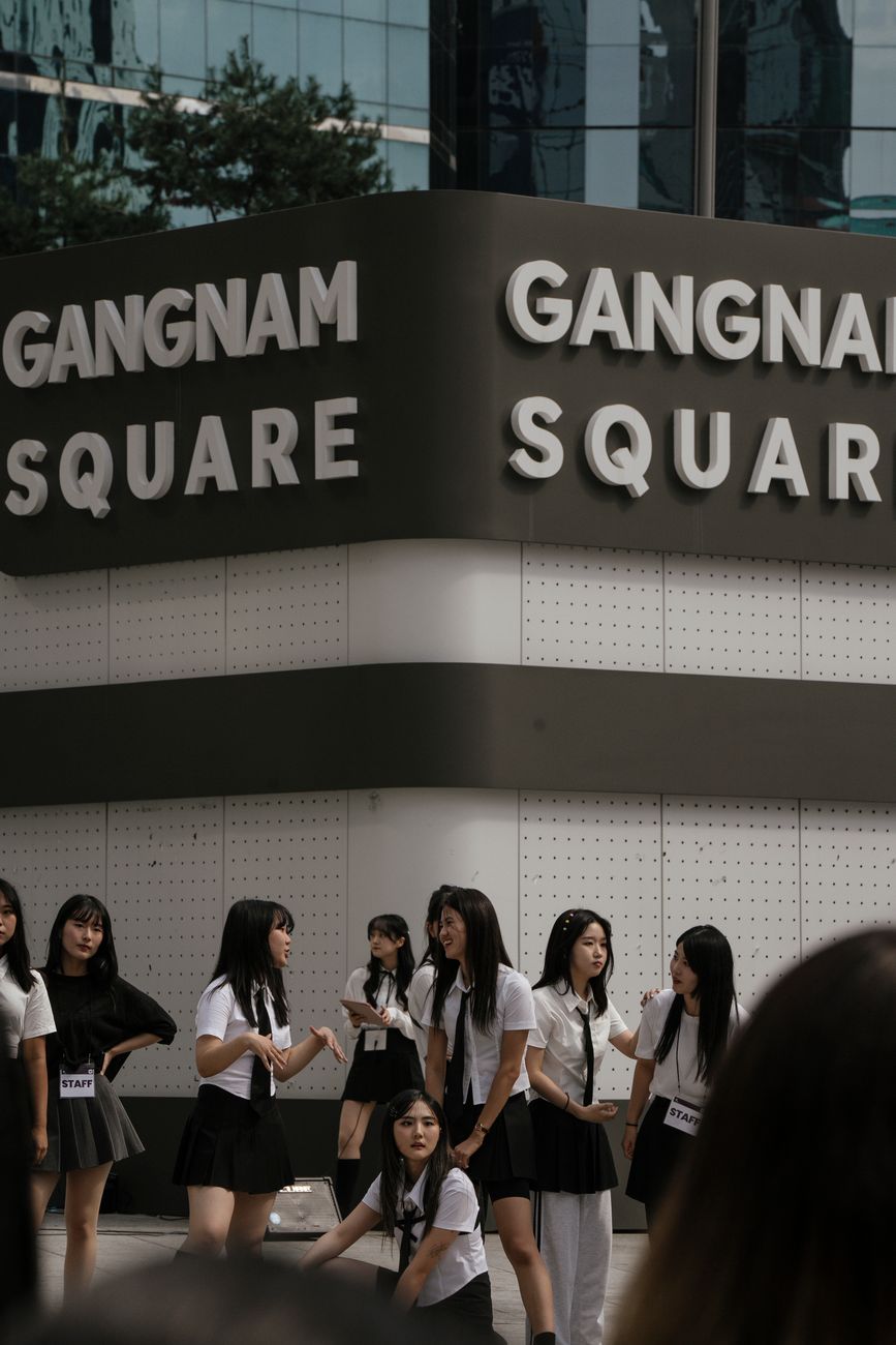 Group of teenage girls in school uniforms at Gangnam Square, Seoul, South Korea.